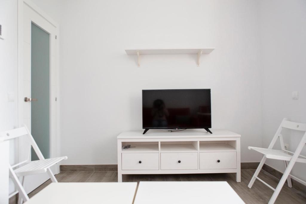 Televízia a/alebo spoločenská miestnosť v ubytovaní Hello Málaga Flat Victoria