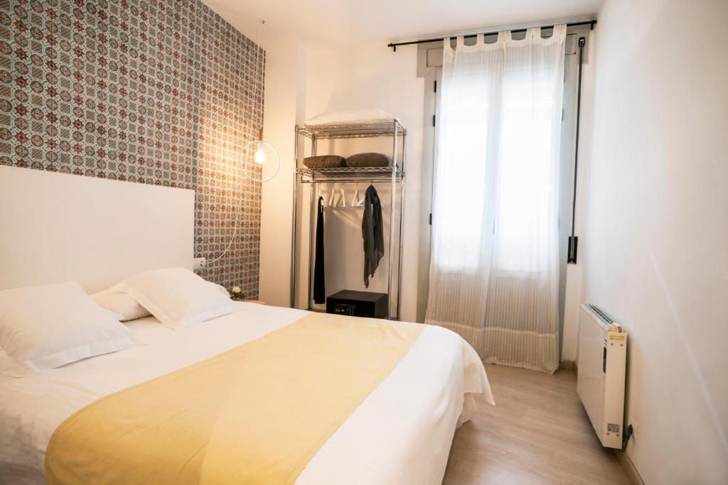 Posteľ alebo postele v izbe v ubytovaní Feelathome Center Apartments