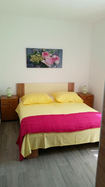 Postel nebo postele na pokoji v ubytování Apartments J&K