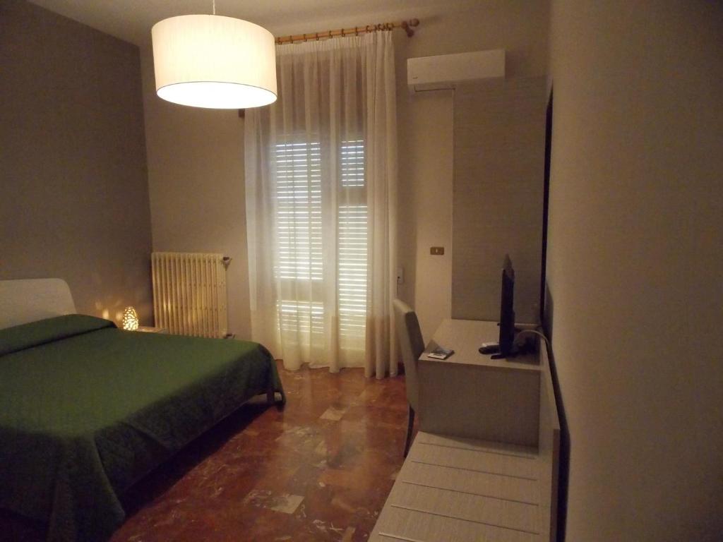 Łóżko lub łóżka w pokoju w obiekcie B&B Soli D'oro