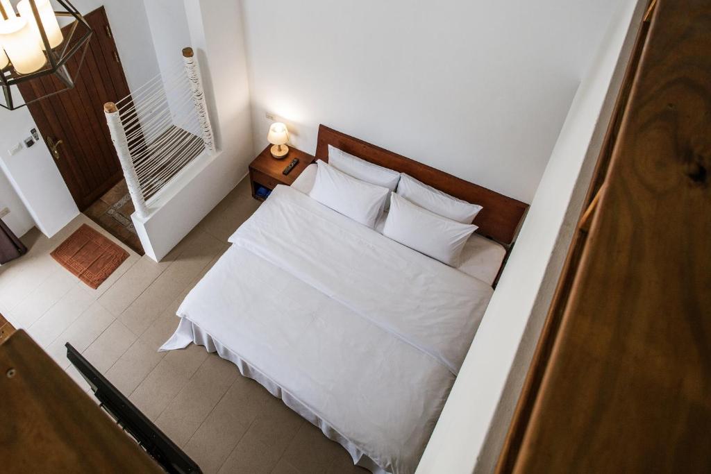 Postel nebo postele na pokoji v ubytování Oasis Hotel