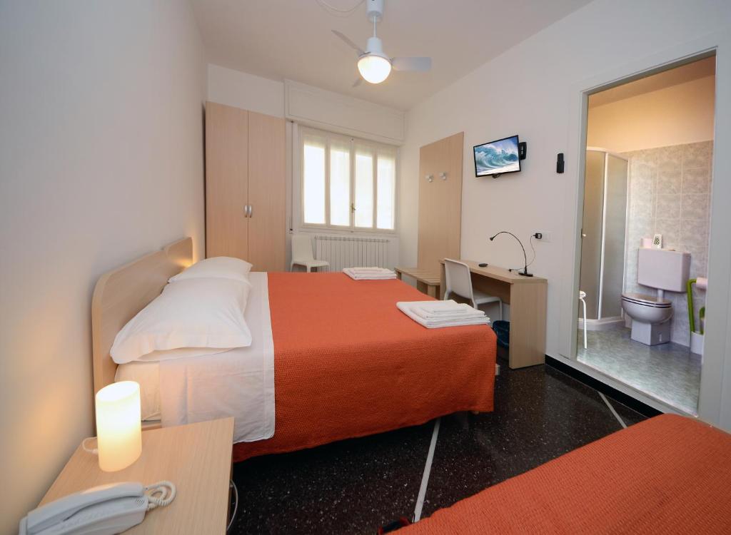 Łóżko lub łóżka w pokoju w obiekcie Locanda Marita