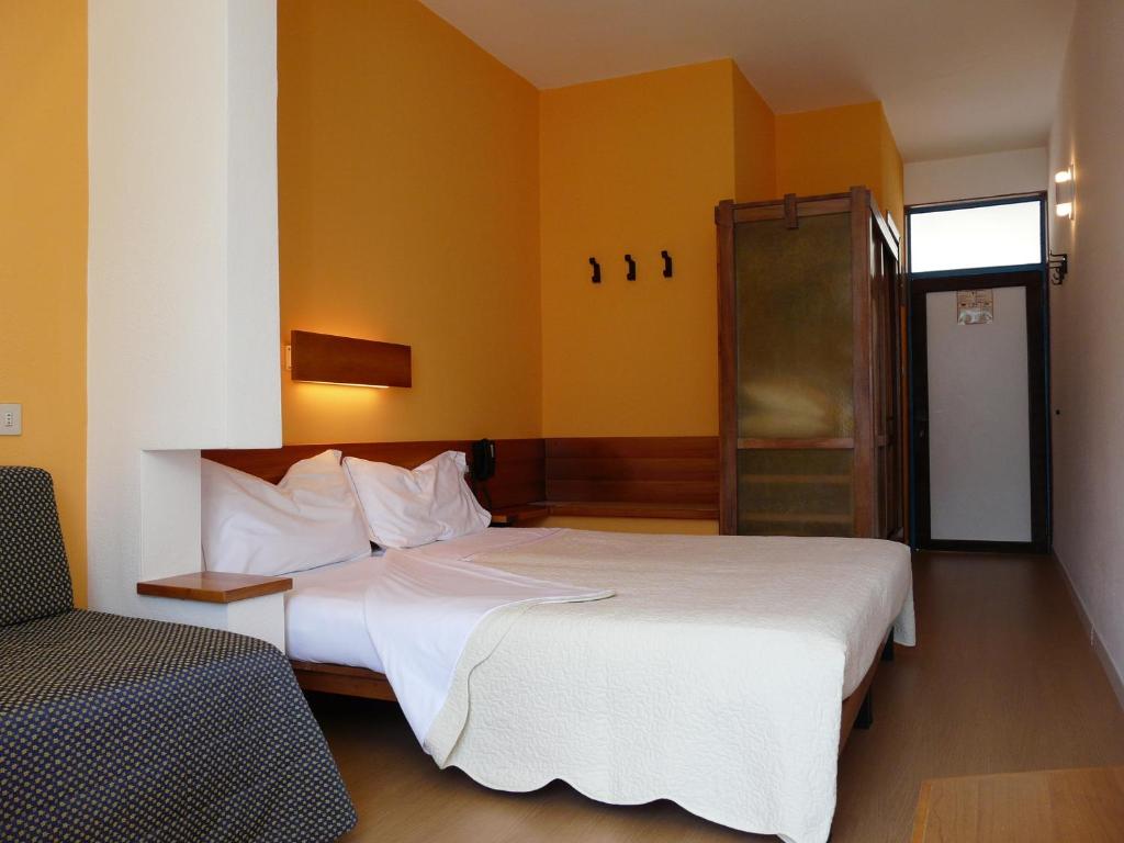 Postel nebo postele na pokoji v ubytování Hotel Lido