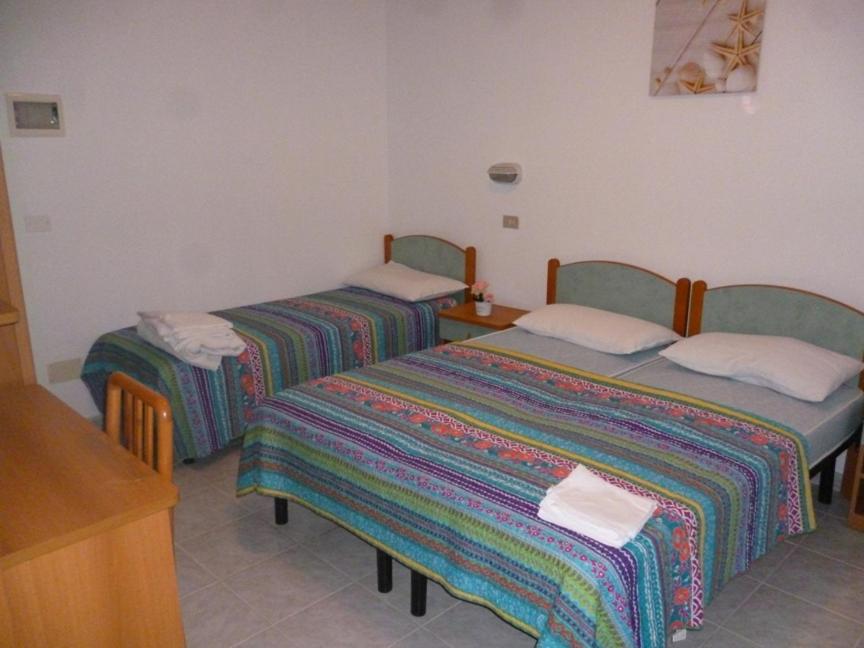 Postel nebo postele na pokoji v ubytování Residence BluAdria