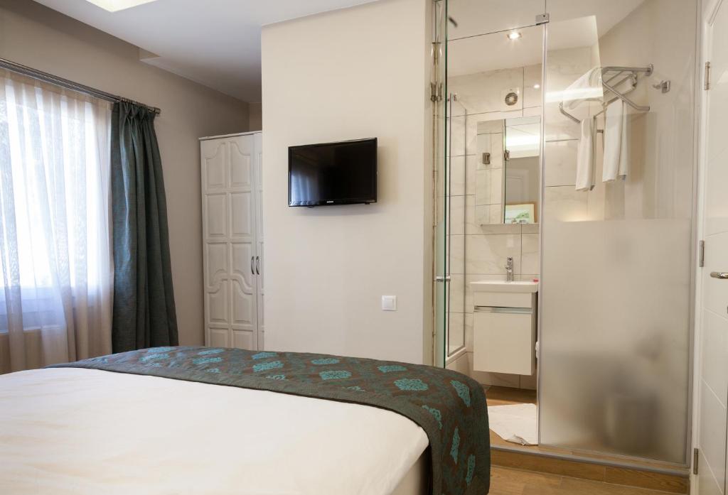 Postel nebo postele na pokoji v ubytování Sun Garden Apart Hotel