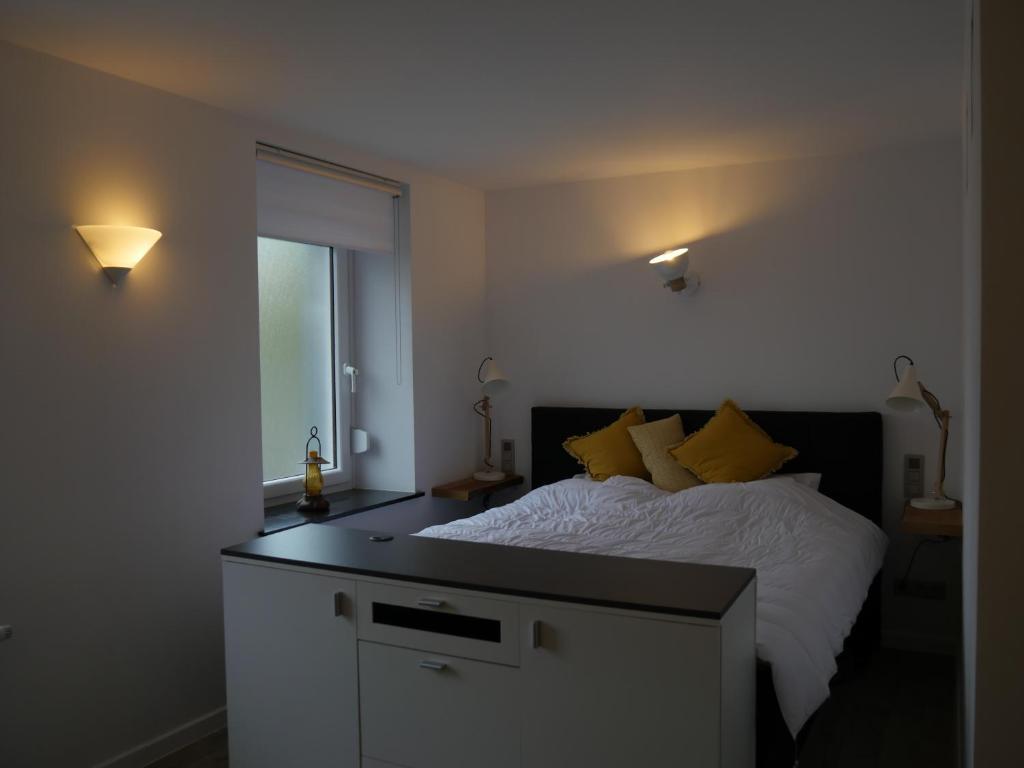 Postel nebo postele na pokoji v ubytování Aparthouse HAAS41 - Eupen