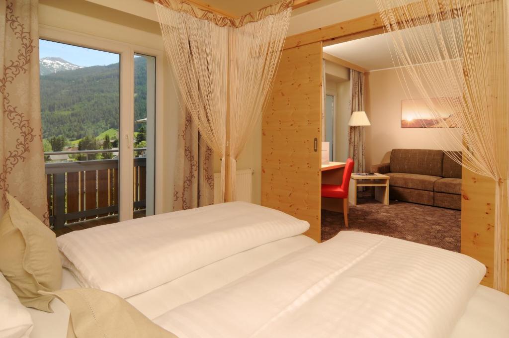 Postel nebo postele na pokoji v ubytování Hotel Tauernstern