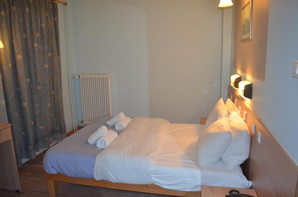 Postel nebo postele na pokoji v ubytování Rozos Hotel