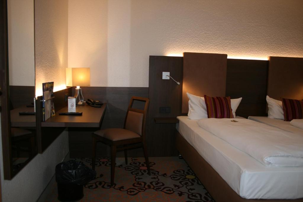 Postel nebo postele na pokoji v ubytování HOTEL PARQÉO im A66
