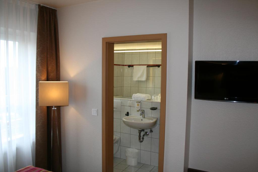 Koupelna v ubytování HOTEL PARQÉO im A66