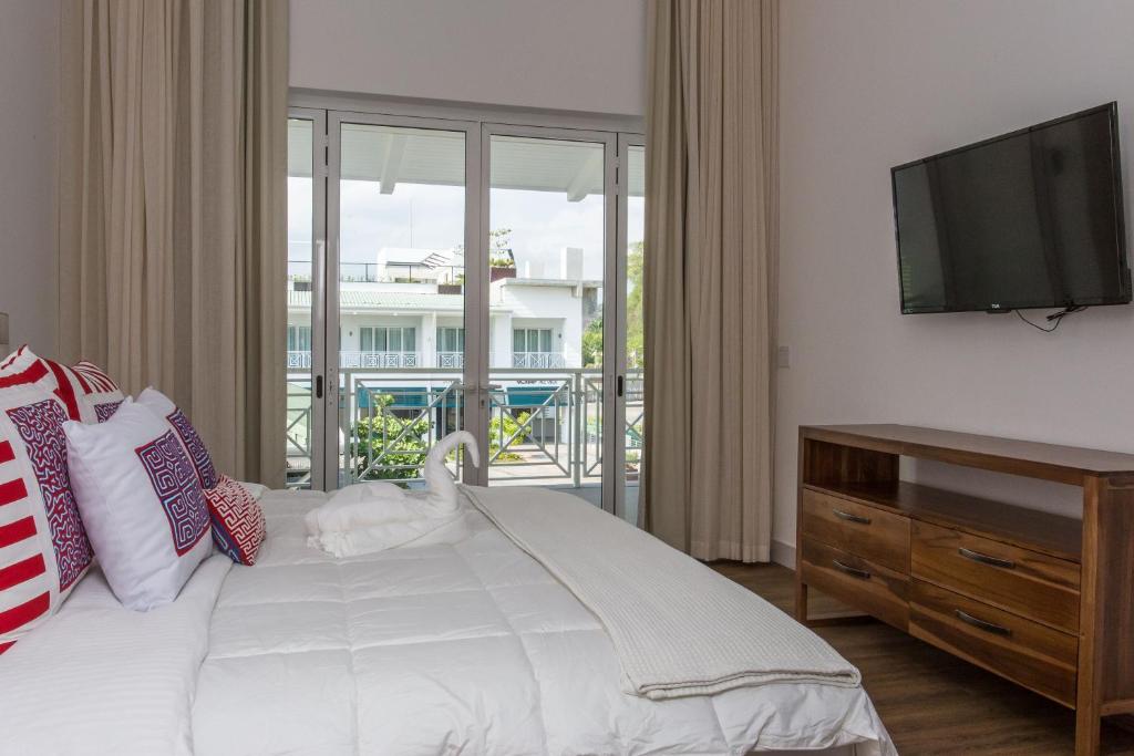 Postel nebo postele na pokoji v ubytování Las Villas Marina Pez Vela