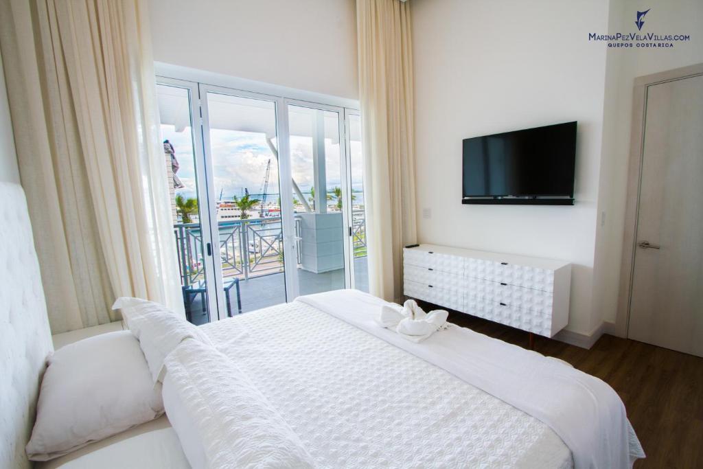 Postel nebo postele na pokoji v ubytování Las Villas Marina Pez Vela