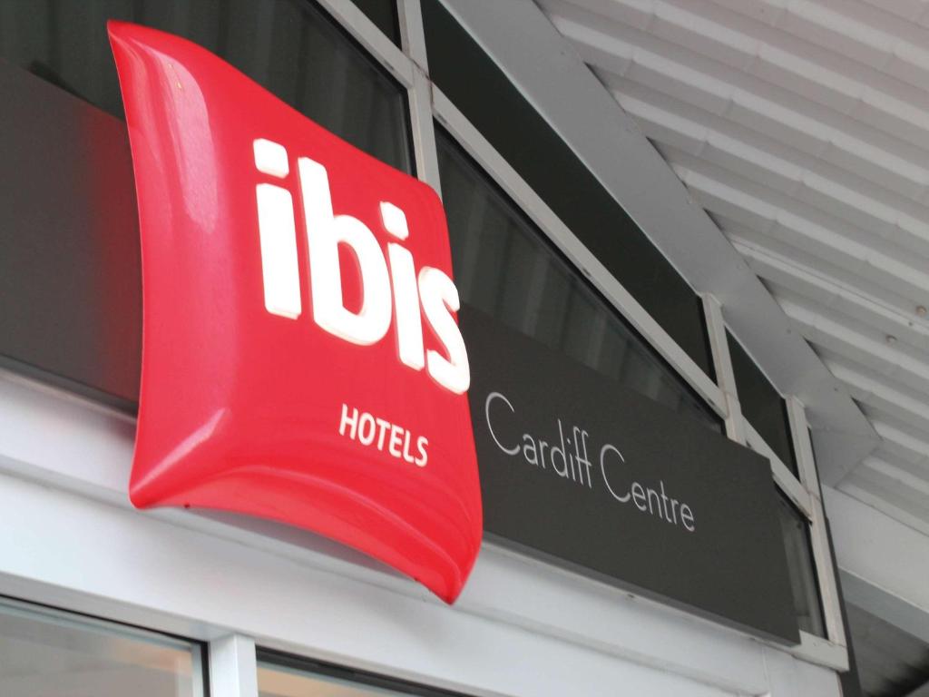 
a sign that is on a building at ibis Cardiff Centre in Cardiff
