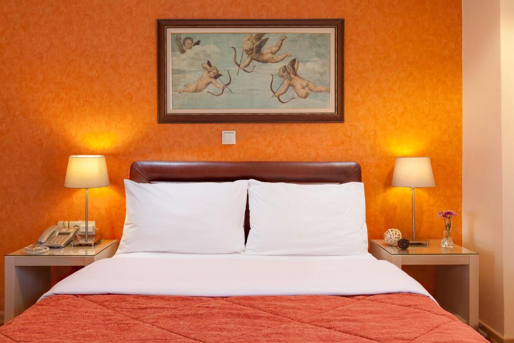 Postel nebo postele na pokoji v ubytování Lilia Hotel