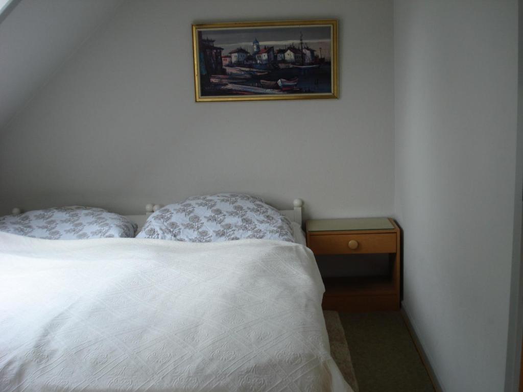 Postel nebo postele na pokoji v ubytování Mikkelborg Kro