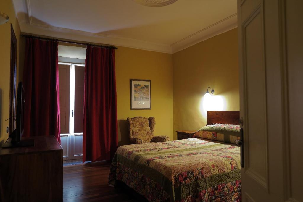 Posteľ alebo postele v izbe v ubytovaní Hostal Esmeralda