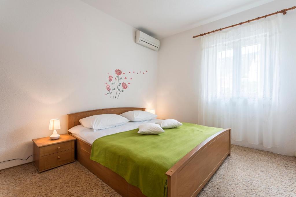 Postel nebo postele na pokoji v ubytování Apartmani Bezma