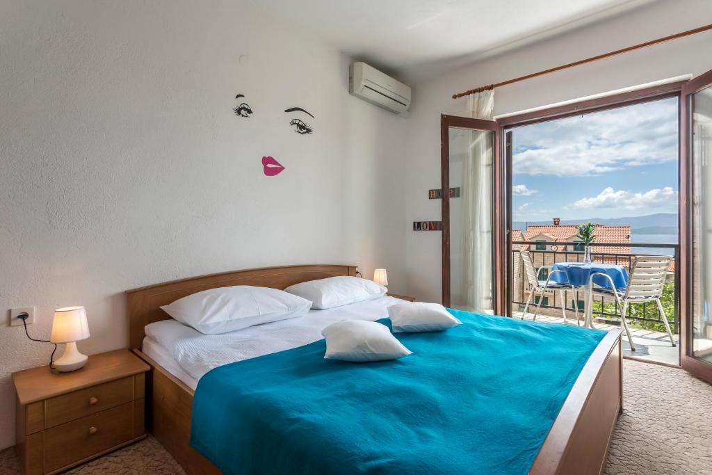 Postel nebo postele na pokoji v ubytování Apartmani Bezma