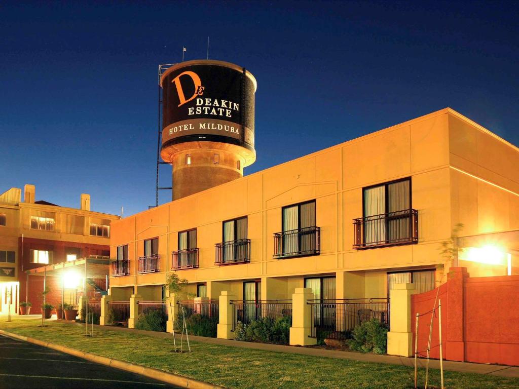 a building with a water tower on top of it at Mercure Hotel Mildura in Mildura