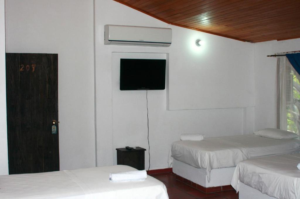 Postel nebo postele na pokoji v ubytování Hotel y Parque Acuatico Agua Sol Alegria