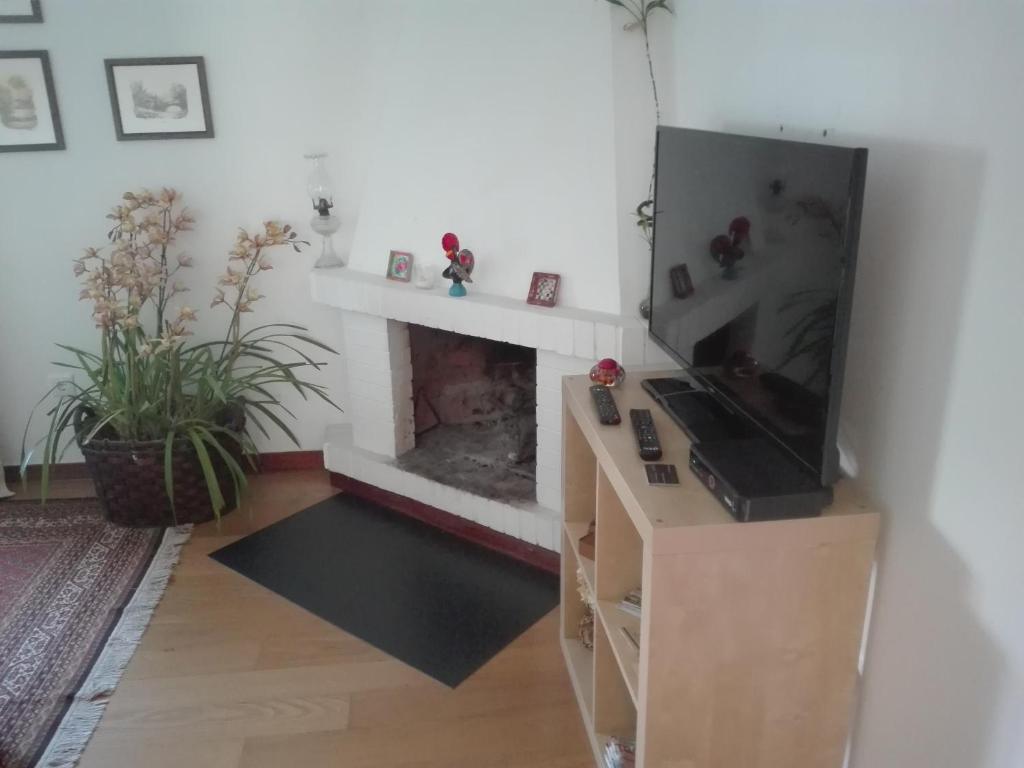 TV a/nebo společenská místnost v ubytování Aconchego do Lar