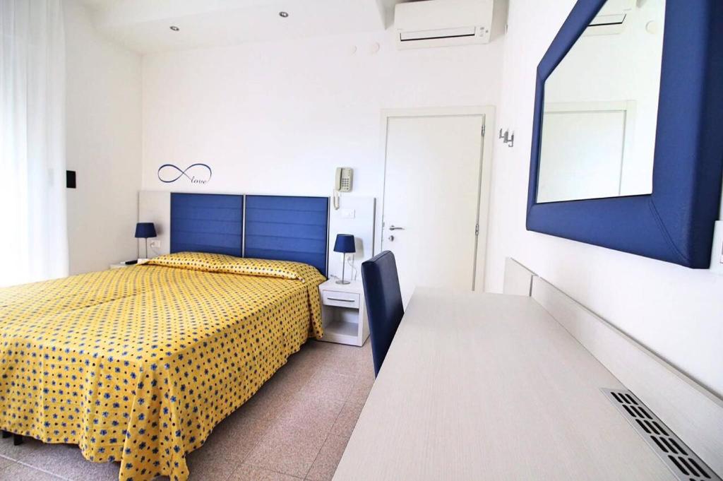 Postel nebo postele na pokoji v ubytování Hotel Eraclea