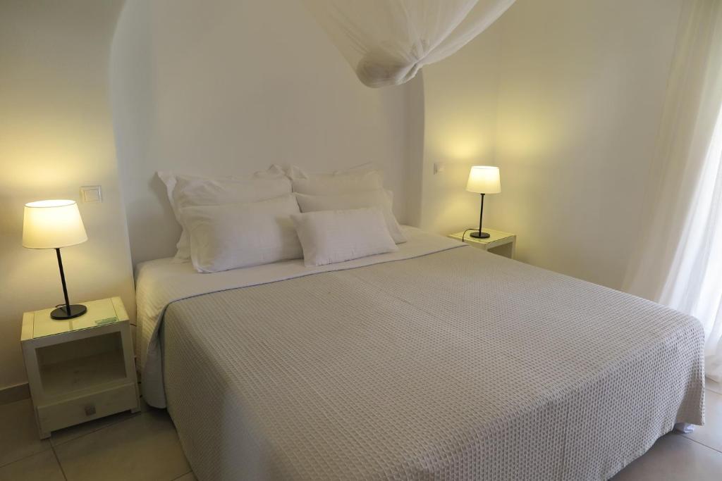 Postel nebo postele na pokoji v ubytování Villa Kampanelli