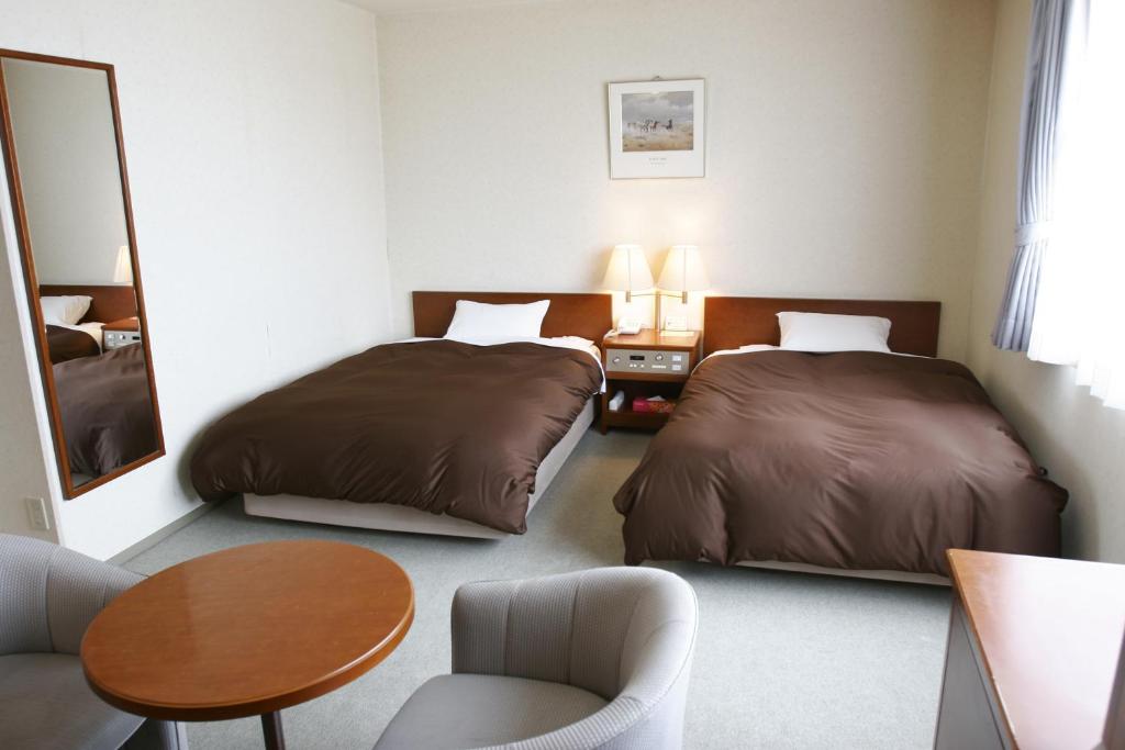 Katil atau katil-katil dalam bilik di Utazu Grand Hotel