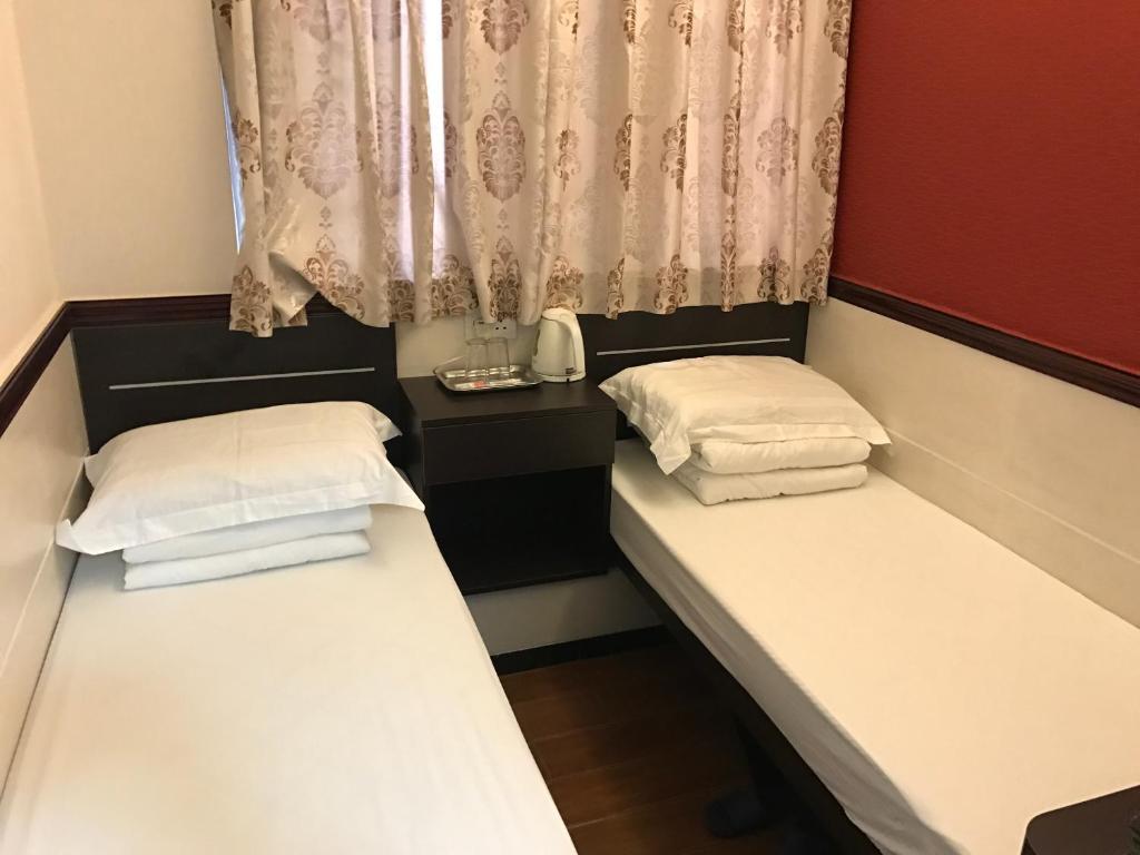 Voodi või voodid majutusasutuse Lap Shun Hostel toas
