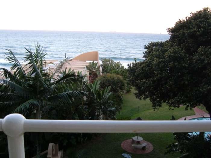 a view of the ocean from a balcony at 20 Mallorca Duplex in Umdloti