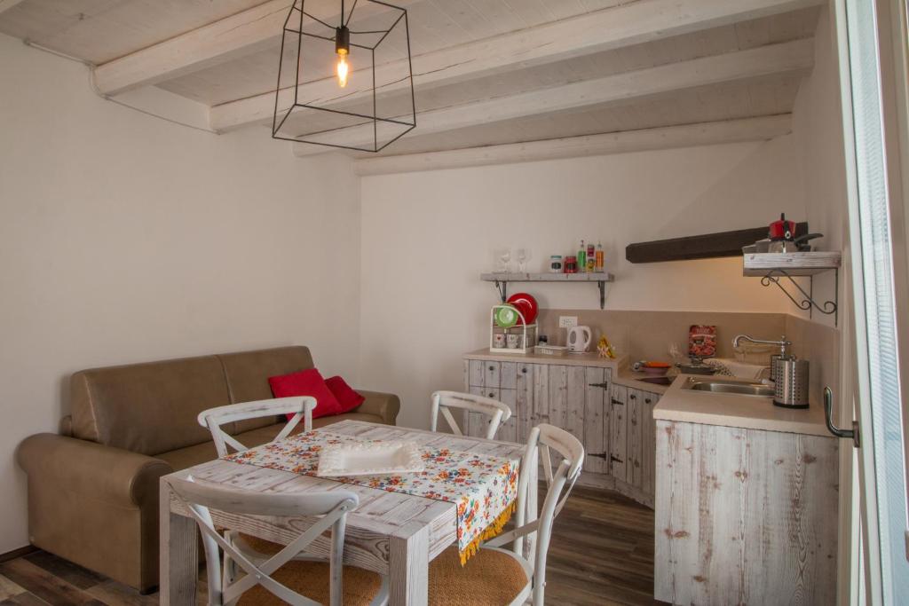 a living room with a table and a couch at Casa Martina in Monopoli