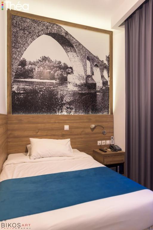 Łóżko lub łóżka w pokoju w obiekcie Marianna Hotel