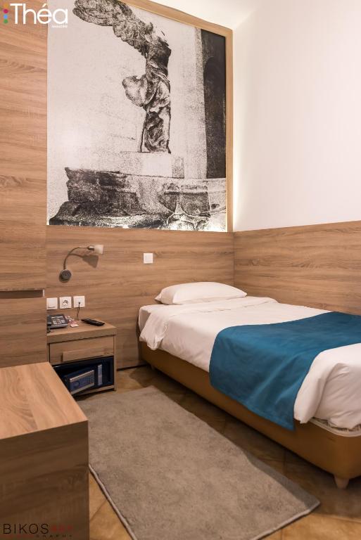 Łóżko lub łóżka w pokoju w obiekcie Marianna Hotel