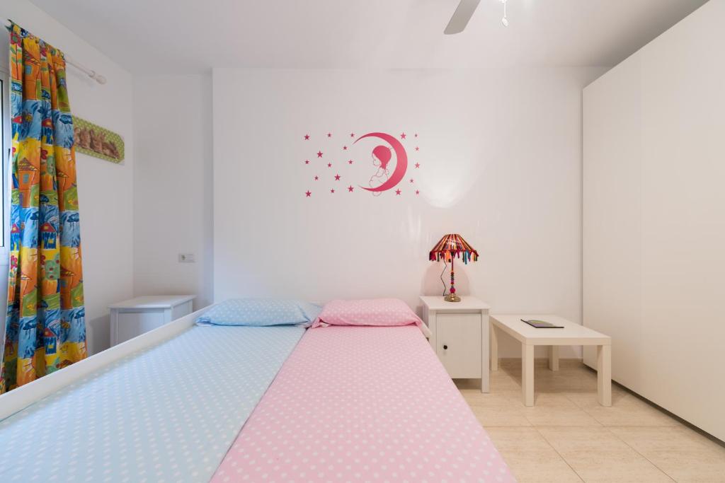 Postel nebo postele na pokoji v ubytování Casa Angel A3