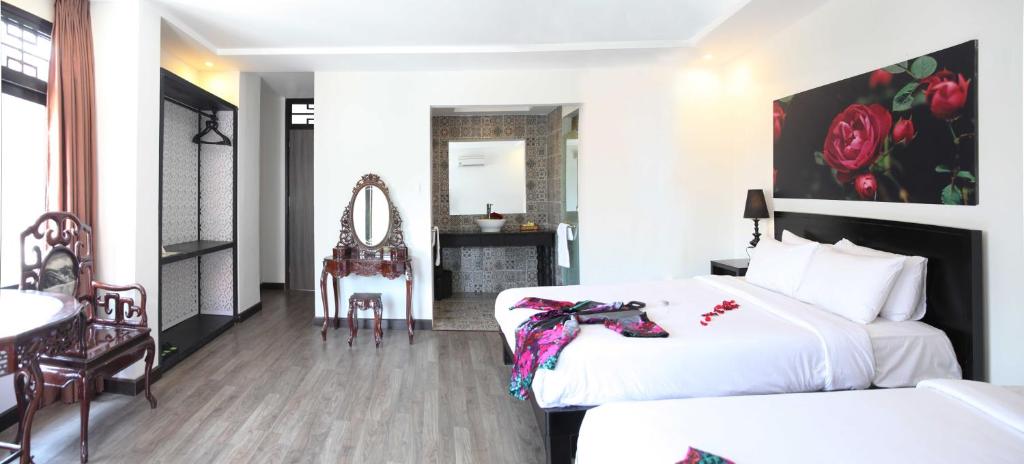 Postel nebo postele na pokoji v ubytování Thanh Binh 2 Hotel
