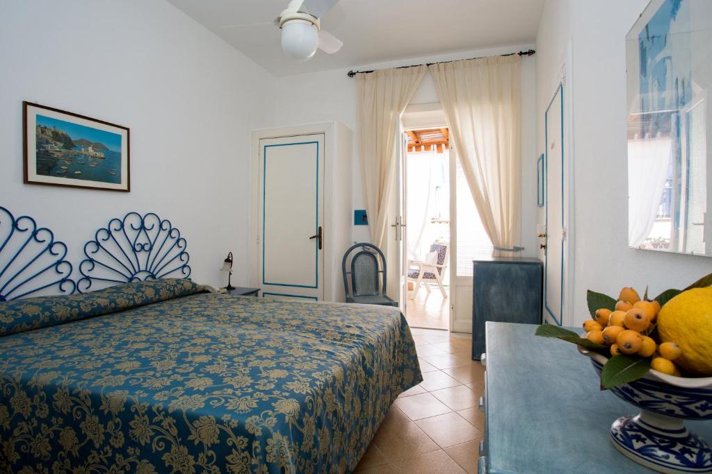Postel nebo postele na pokoji v ubytování Hotel Poseidon