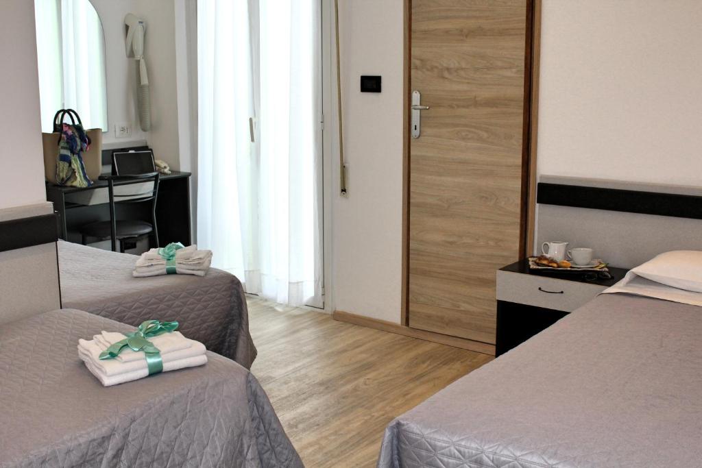 Postel nebo postele na pokoji v ubytování Hotel Tre Stelle
