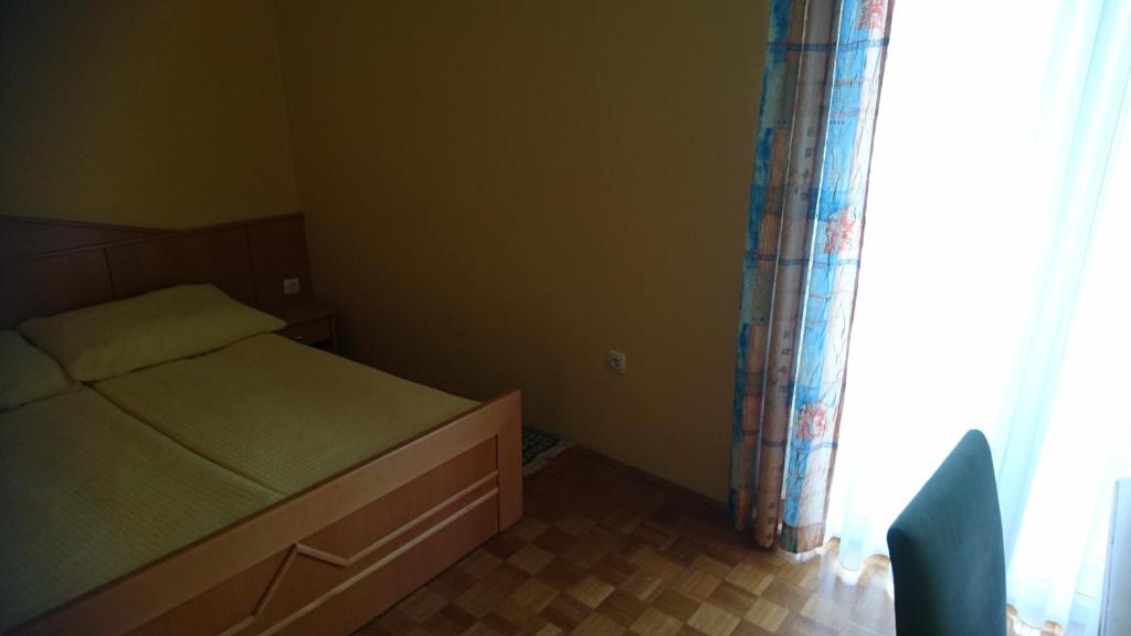Postel nebo postele na pokoji v ubytování Penzion Zeleni Kakadu