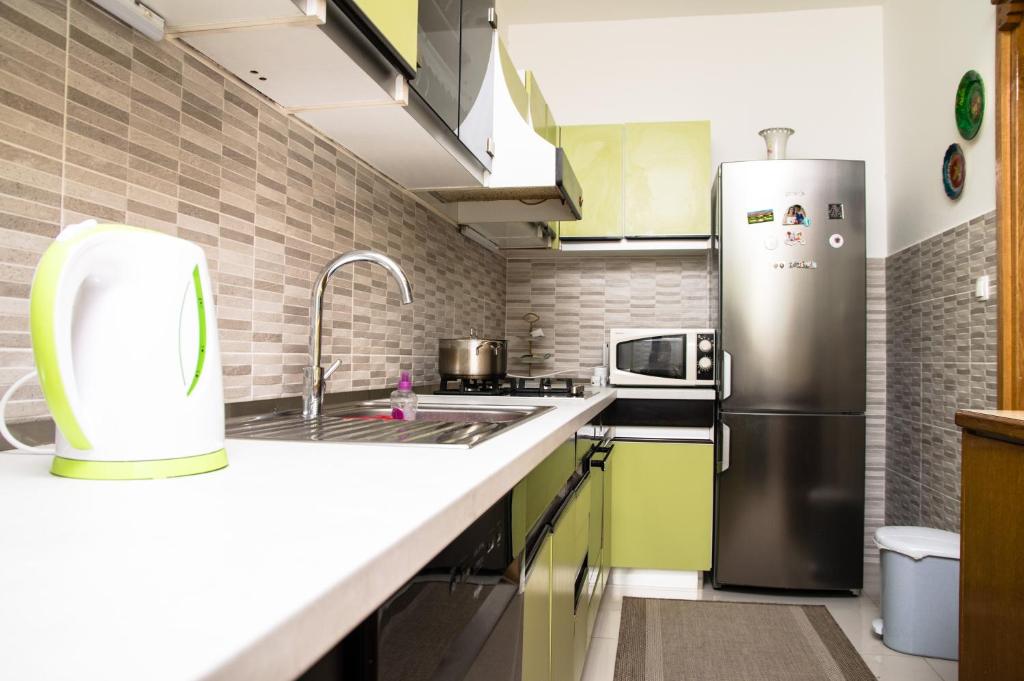 Kuchyň nebo kuchyňský kout v ubytování Mala Kate Apartments