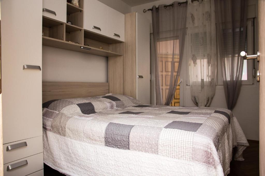 Postel nebo postele na pokoji v ubytování Mala Kate Apartments