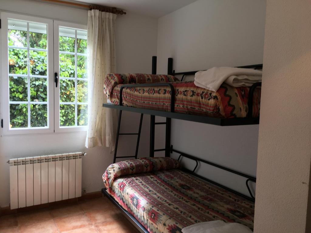 Postel nebo postele na pokoji v ubytování Os Arroxos