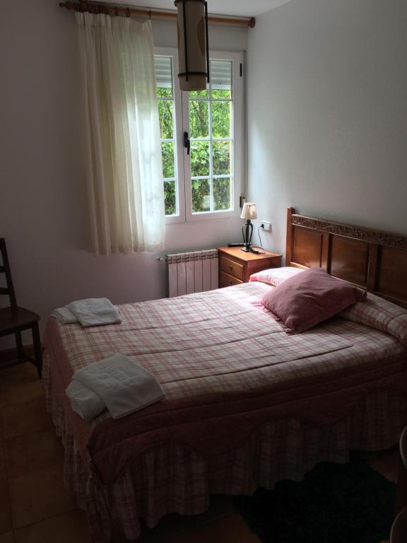 Postel nebo postele na pokoji v ubytování Os Arroxos