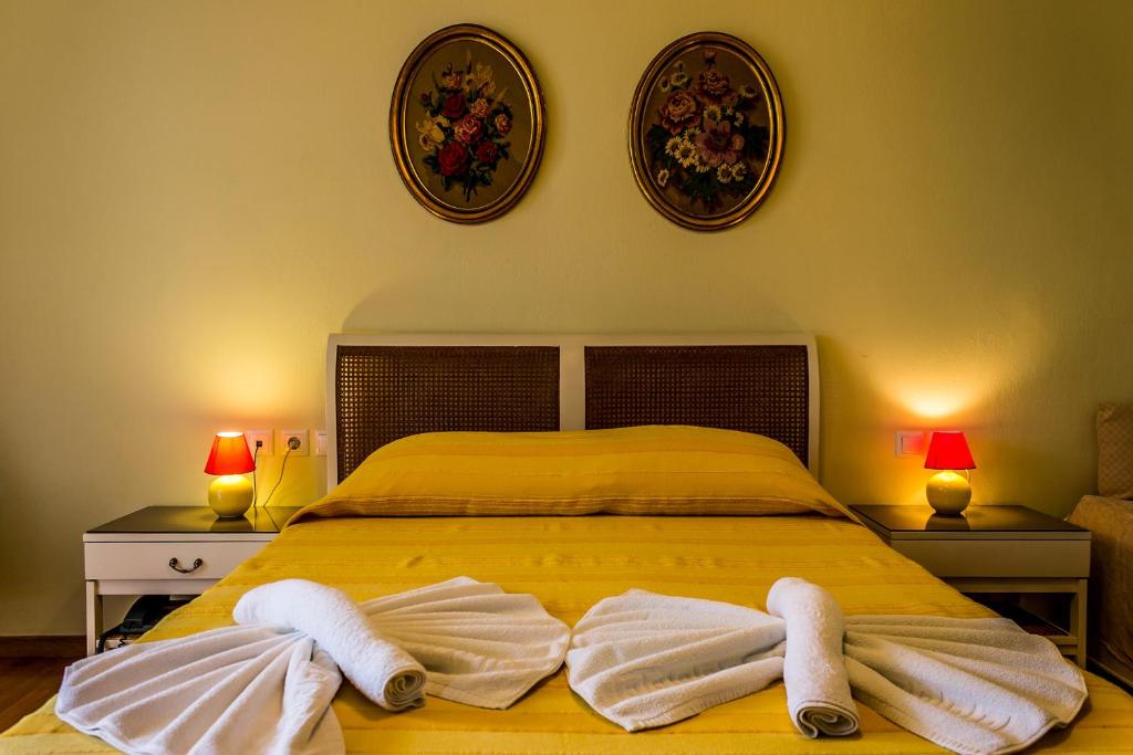 Ένα ή περισσότερα κρεβάτια σε δωμάτιο στο Hotel Mato