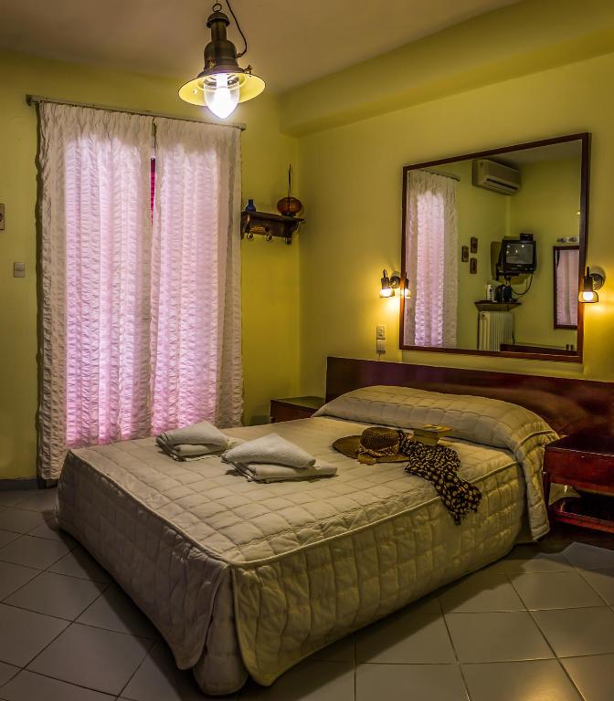 Postel nebo postele na pokoji v ubytování Hotel Mato