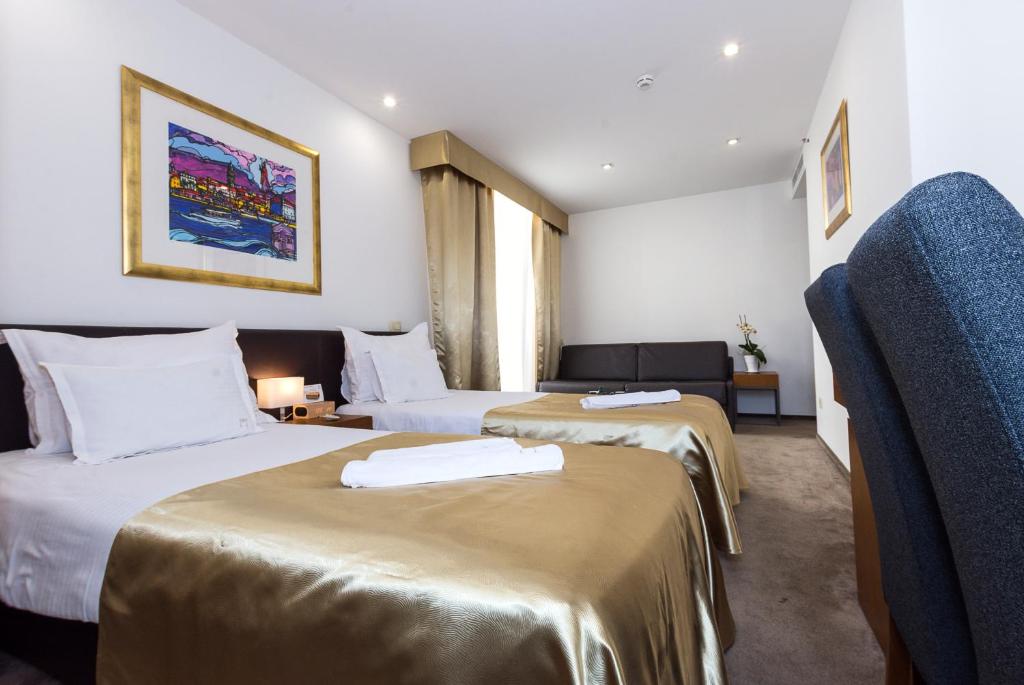 Postel nebo postele na pokoji v ubytování Hotel Marul