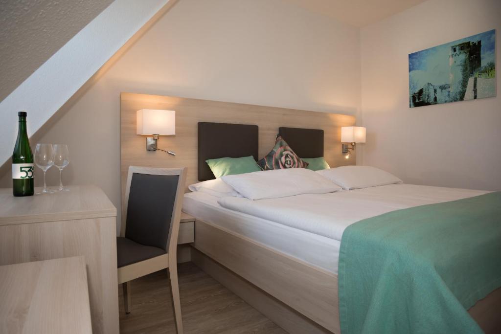 Postel nebo postele na pokoji v ubytování Hotel Zum Bären