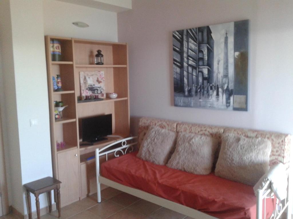 A television and/or entertainment centre at Foivos Seaside Apartments