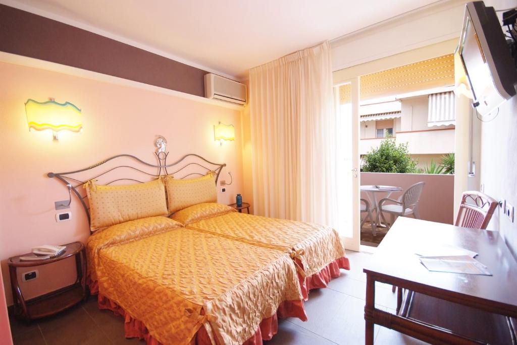 Кровать или кровати в номере Hotel Barcarola 2