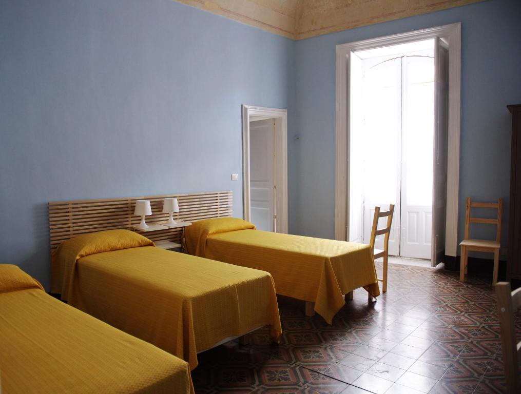 A bed or beds in a room at B&B Porta della Terra