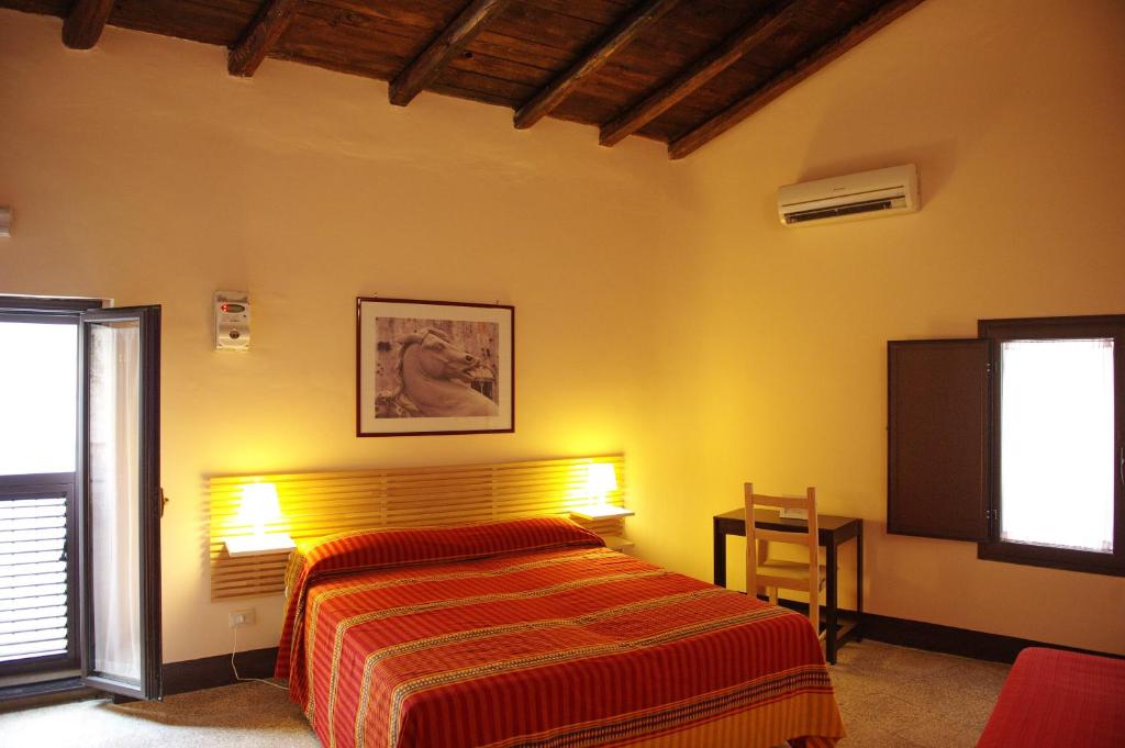 A bed or beds in a room at B&B Porta della Terra